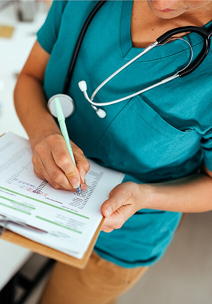 Veterinarian writing down a list of To-Dos